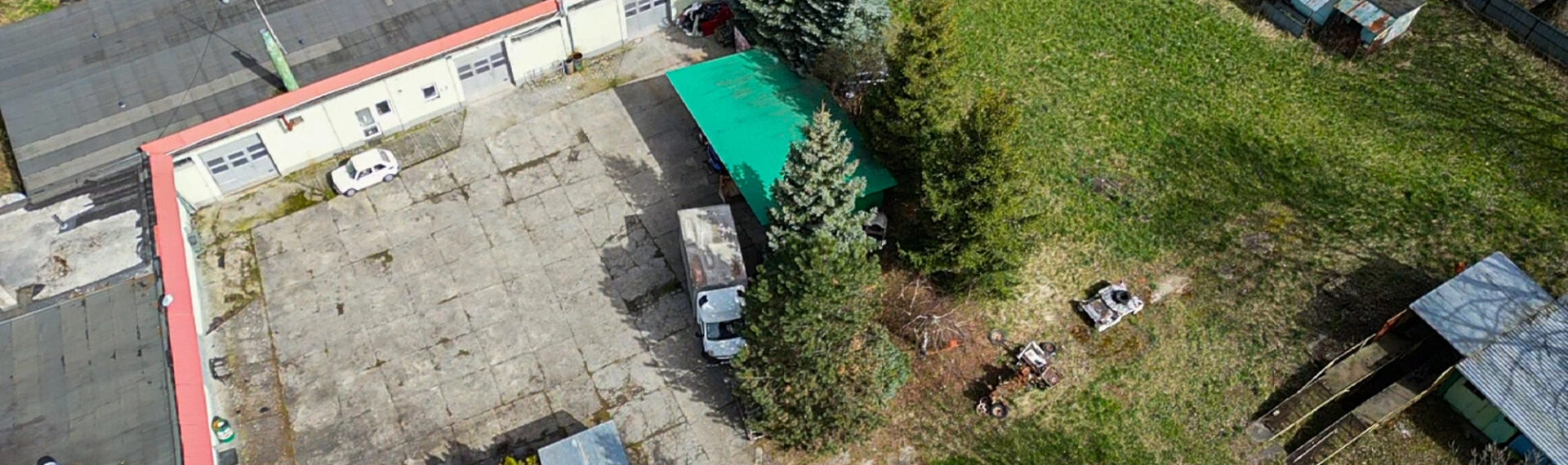 Działka zabudowana budynkiem warsztatowo-socjalnym