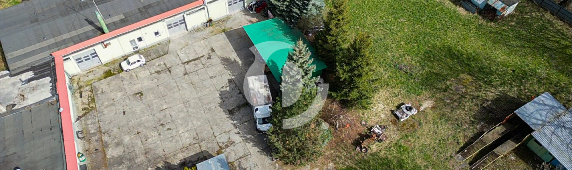 Działka zabudowana budynkiem warsztatowo-socjalnym